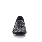 Black floral-patterned slip-on shoe on a white background