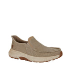 Beige slip-on shoe with brown sole on a white background