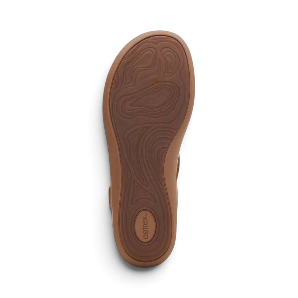 The Happy Shoe Shop Aetrex Tracey sandal showing the brown rubber outsole with a textured topographical tread pattern.