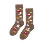 The Happy Shoe Shop Women's Bakers Gunna Bake bamboo socks in taupe with baking graphics. Features kitchen tools and treats.