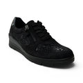 The Happy Shoe Shop ACO Comfort Aberdeen black sneaker with floral patterned panels, side zipper, and lace-up closure.