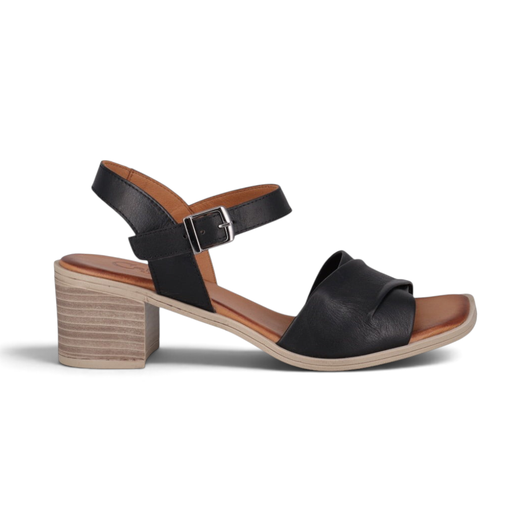 The Happy Shoe Shop Cabello Wiley black leather mid-heel sandal with square toe, block heel, and adjustable strap.
