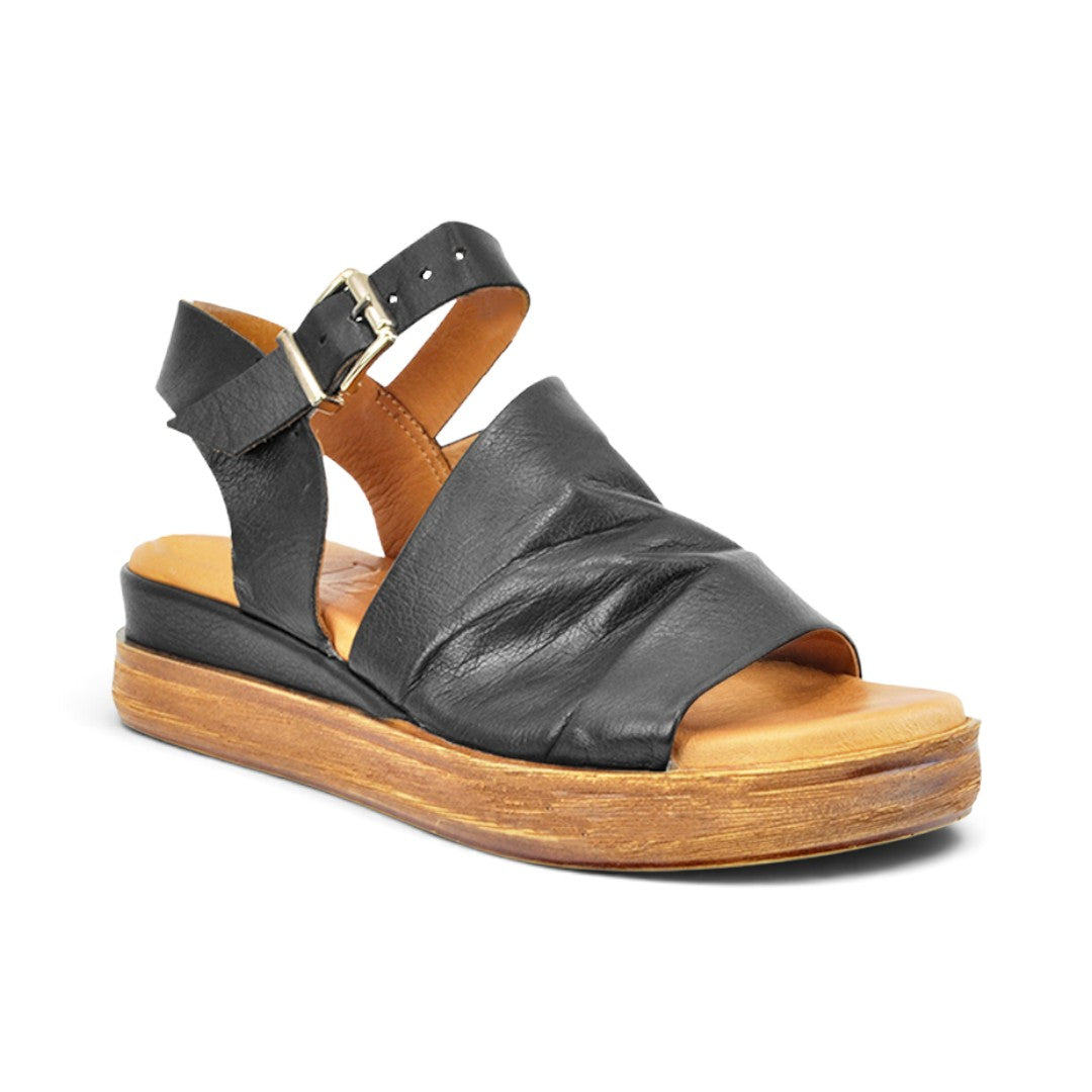 The Happy Shoe Shop Sala Positano black leather wedge sandals with an open toe and adjustable ankle buckle strap.