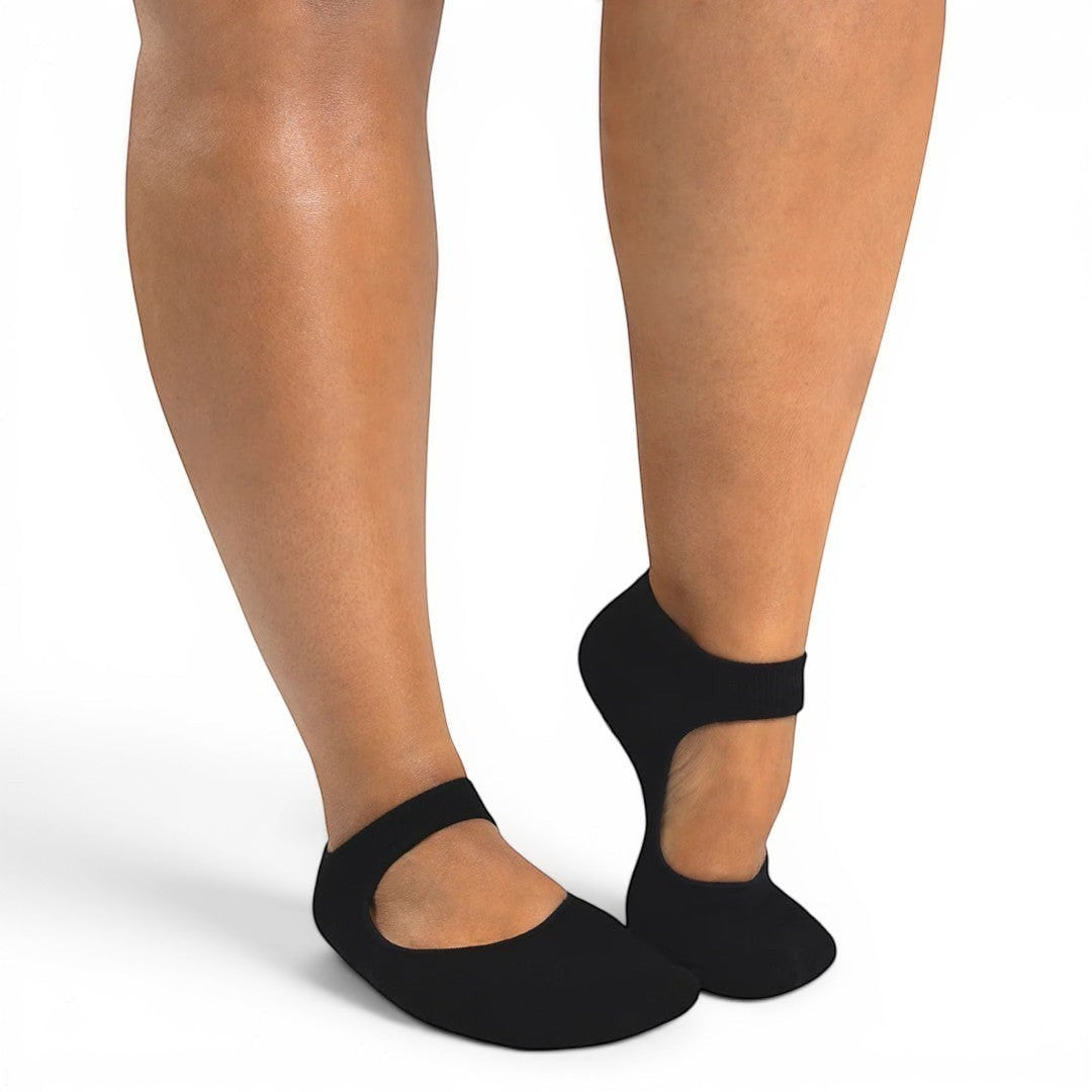 The Happy Shoe Shop black Pilates grip socks with strap across the arch.