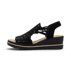 The Happy Shoe Shop Rieker black wedge sandal with intricate cut-out textile upper and cushioned insole