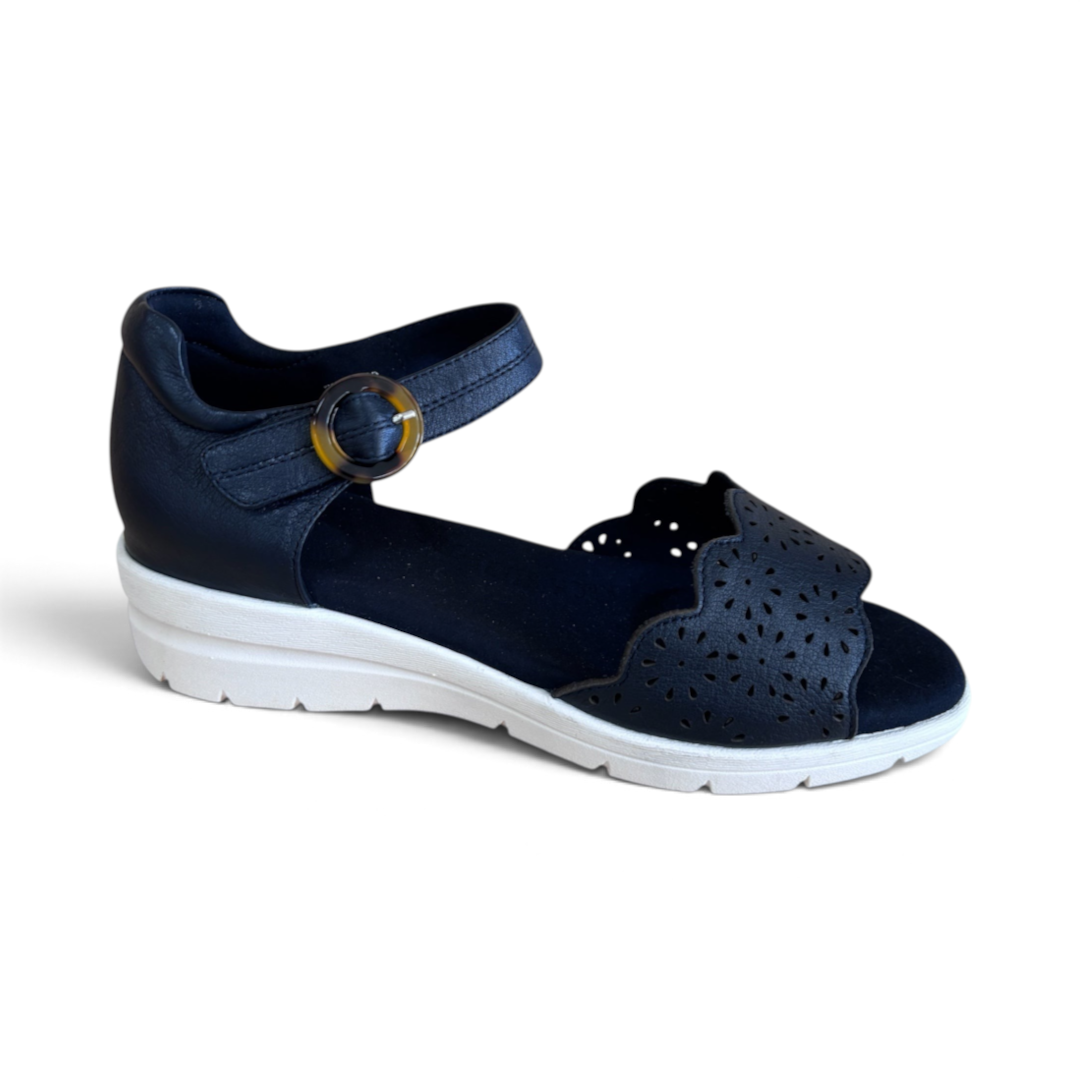 The Happy Shoe Shop Via Nova Rusk blue leather wedge sandals with cutout details, white sole, and buckle strap.