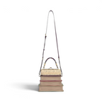 The Happy Shoe Shop Vendula London book stack handbag in vegan leather with a clip-frame opening and crossbody strap.