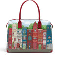 The Happy Shoe Shop Bookshelf Boulevard Bonnie Weekender Tote, a vegan leather bag with a print of colourful book spines and building facades.