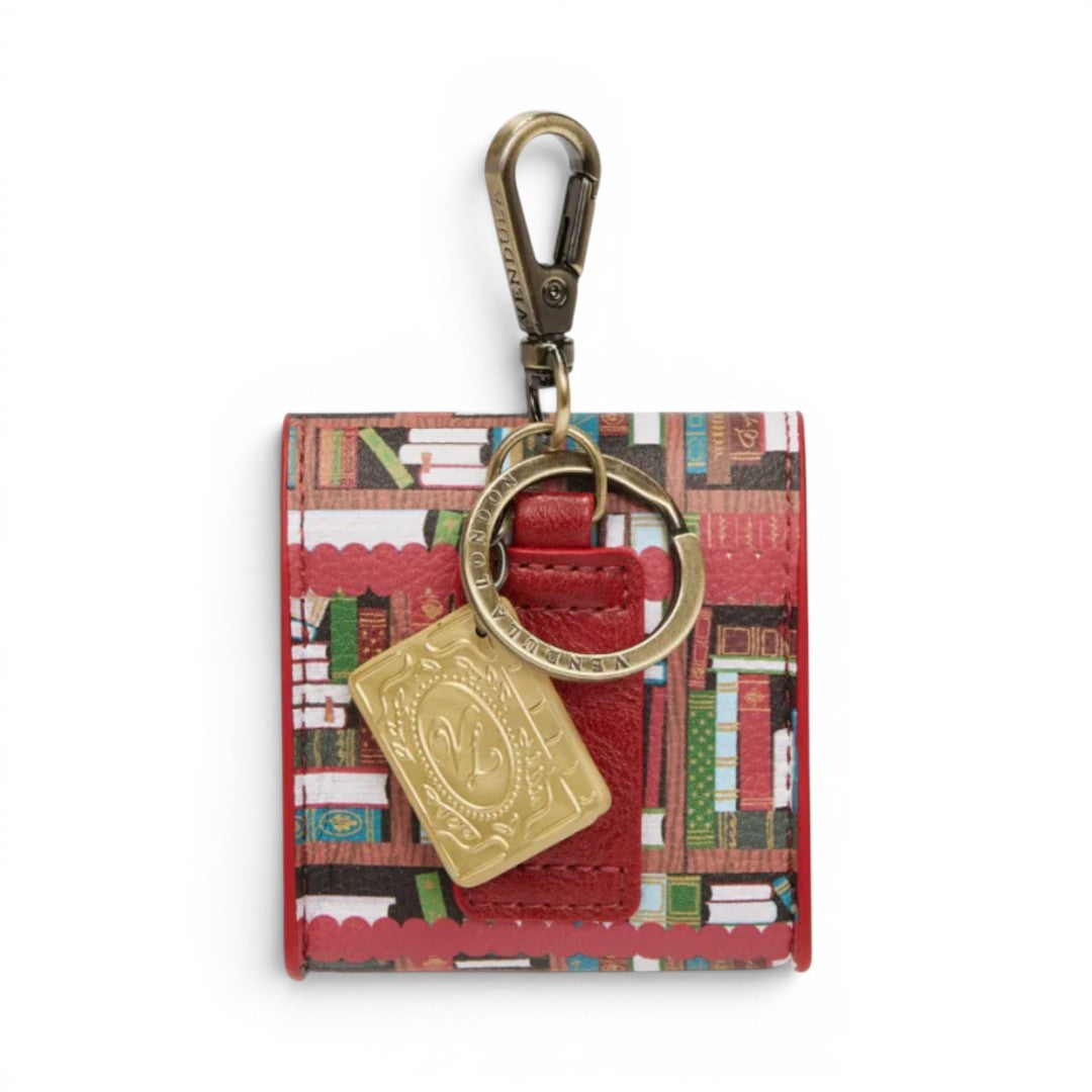 The Happy Shoe Shop Bookshelf Boulevard Pods Case, a small red vegan leather pouch with a bookshelf print, gold charm, and keyring.