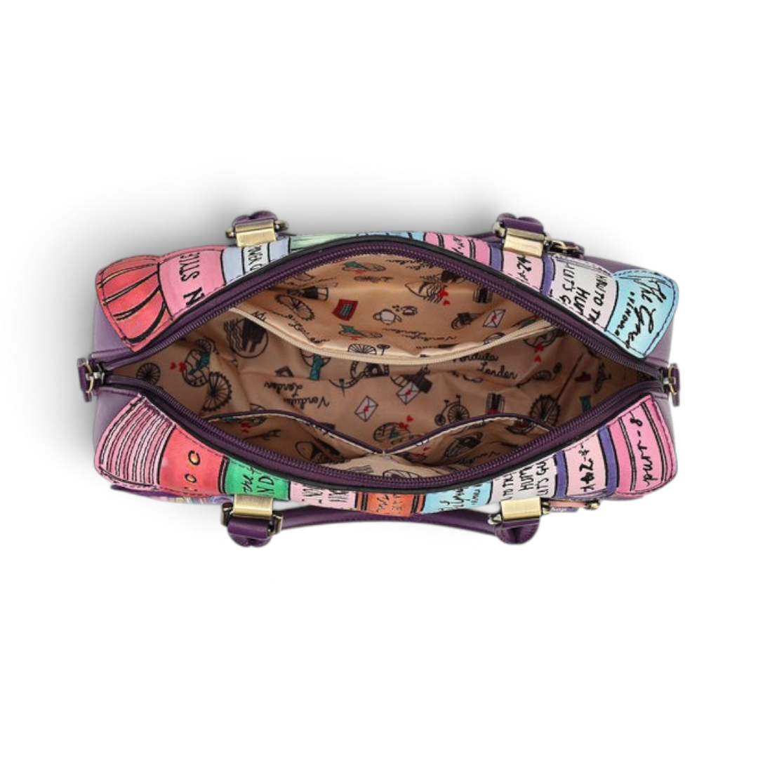 The Happy Shoe Shop Vendula London bowler bag interior showing printed cotton lining, zip pocket, and open compartments.
