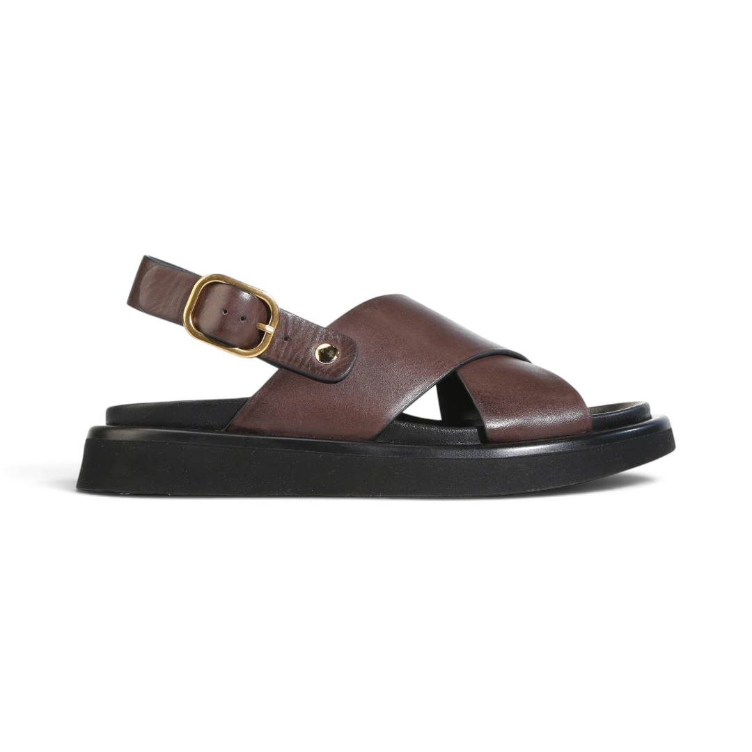 The Happy Shoe Shop EOS Slayter brown leather crossover slingback sandal with a black platform sole and gold buckle.