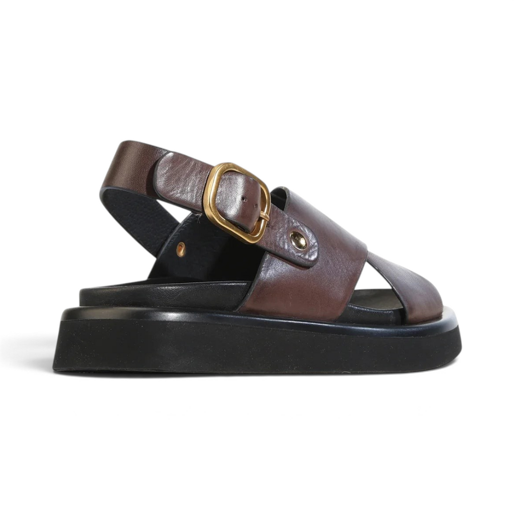The Happy Shoe Shop EOS Slayter brown leather crossover slingback sandal with a black platform sole and gold buckle.
