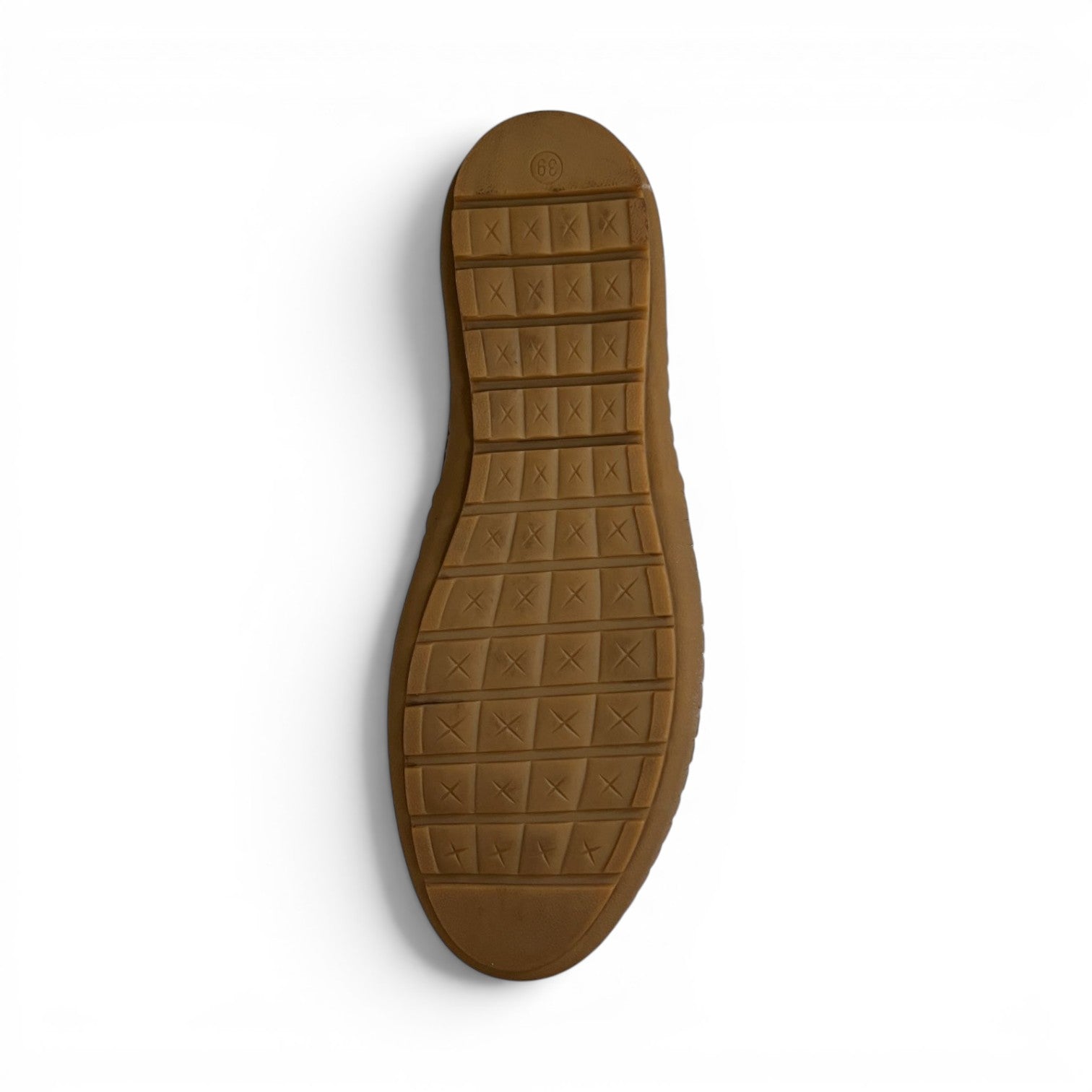 The Happy Shoe Shop Cabello Kylie slip-on shoe showing the flexible brown rubber outsole with grid tread pattern.