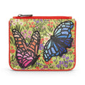 The Happy Shoe Shop Yoshi leather coin purse featuring colourful butterfly appliqués on a floral green background.