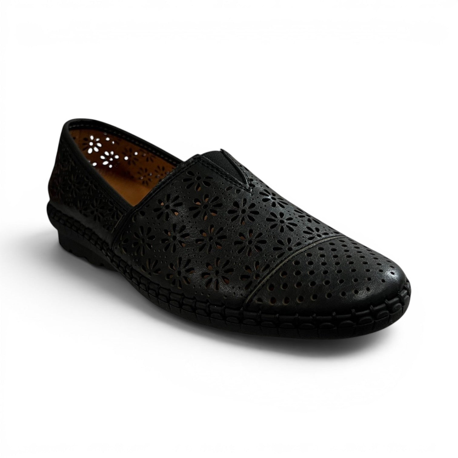 The Happy Shoe Shop Cabello Kylie black leather slip-on shoe with laser-cut floral patterns and elastic gussets.