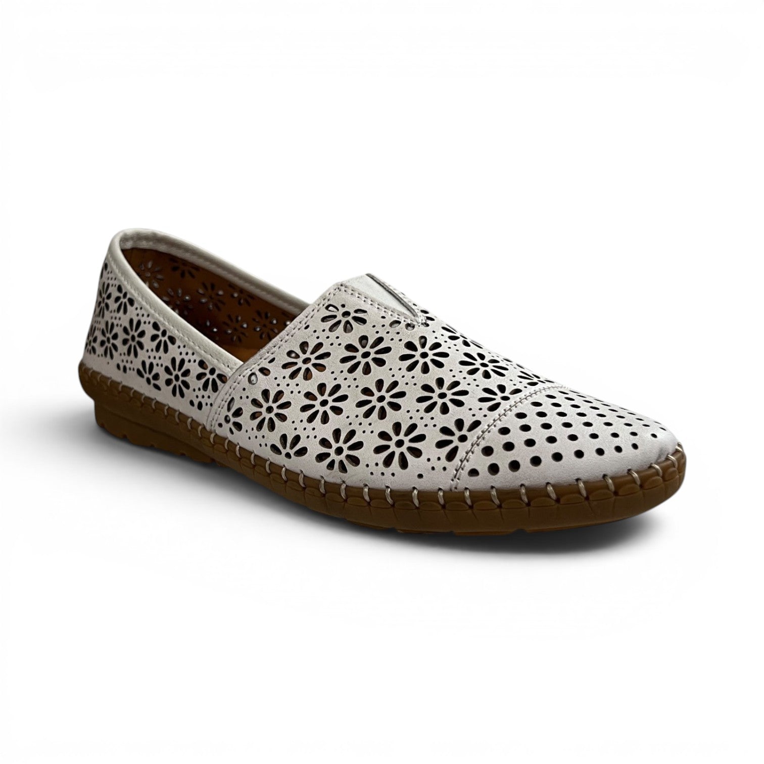 The Happy Shoe Shop Cabello Kylie white leather slip-on shoe with floral laser-cut perforations and rubber sole.