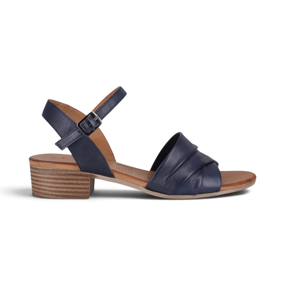 The Happy Shoe Shop Cabello Yenice navy blue leather low block heel sandals with an adjustable ankle strap.