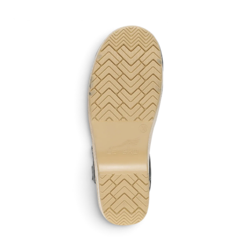 The Happy Shoe Shop Dansko Margreta Mary Jane Clog showing the tan PU rocker bottom outsole with herringbone tread.
