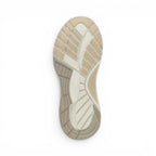 The Happy Shoe Shop Dansko Poppy sneaker rubber outsole with beige and white tread pattern for traction.