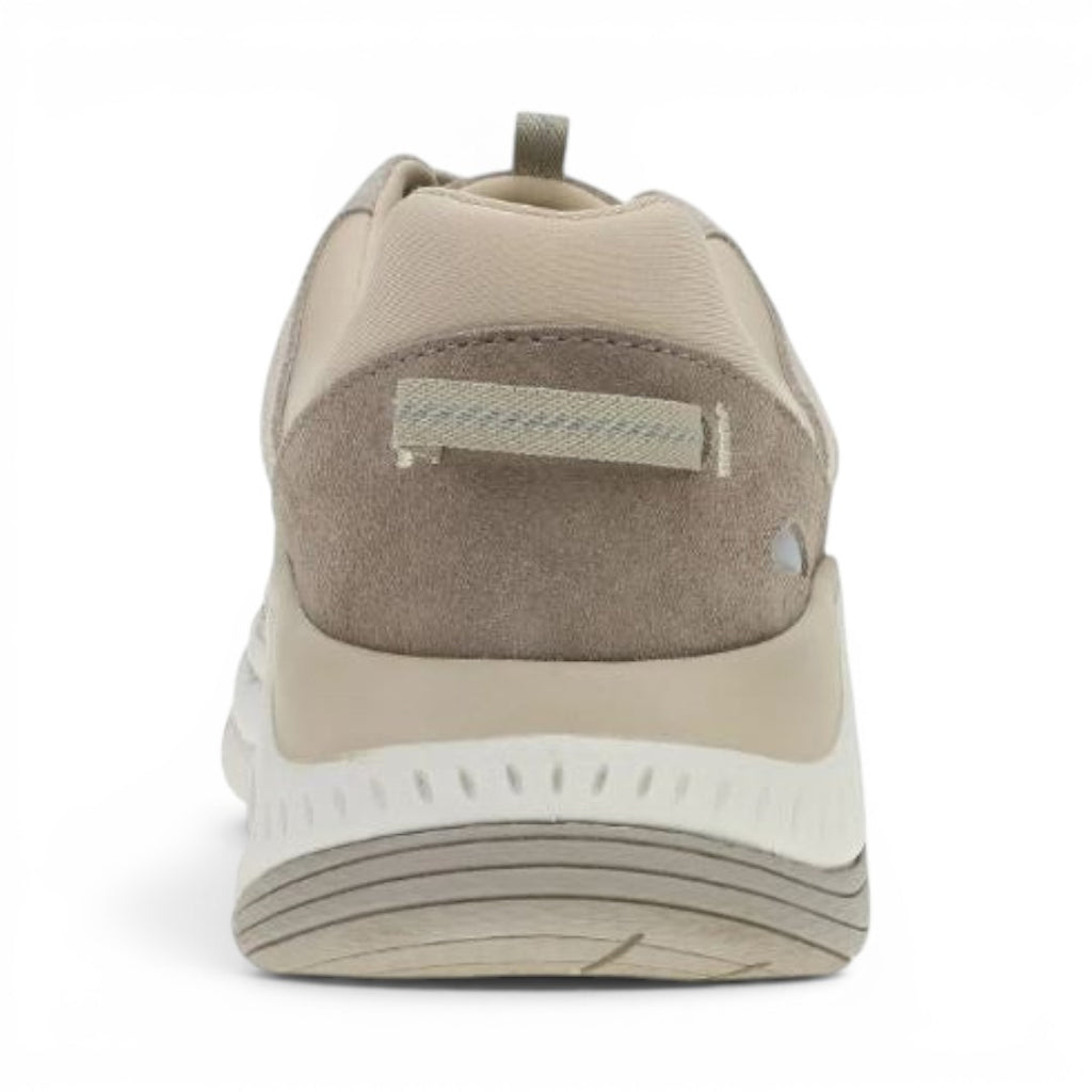 The Happy Shoe Shop Dansko Poppy sneaker in beige leather and mesh, showing the supportive heel and rubber outsole.