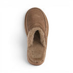 The Happy Shoe Shop Emu Sharky Slide in brown suede with a plush sheepskin lining and distinctive shark-tooth sole.