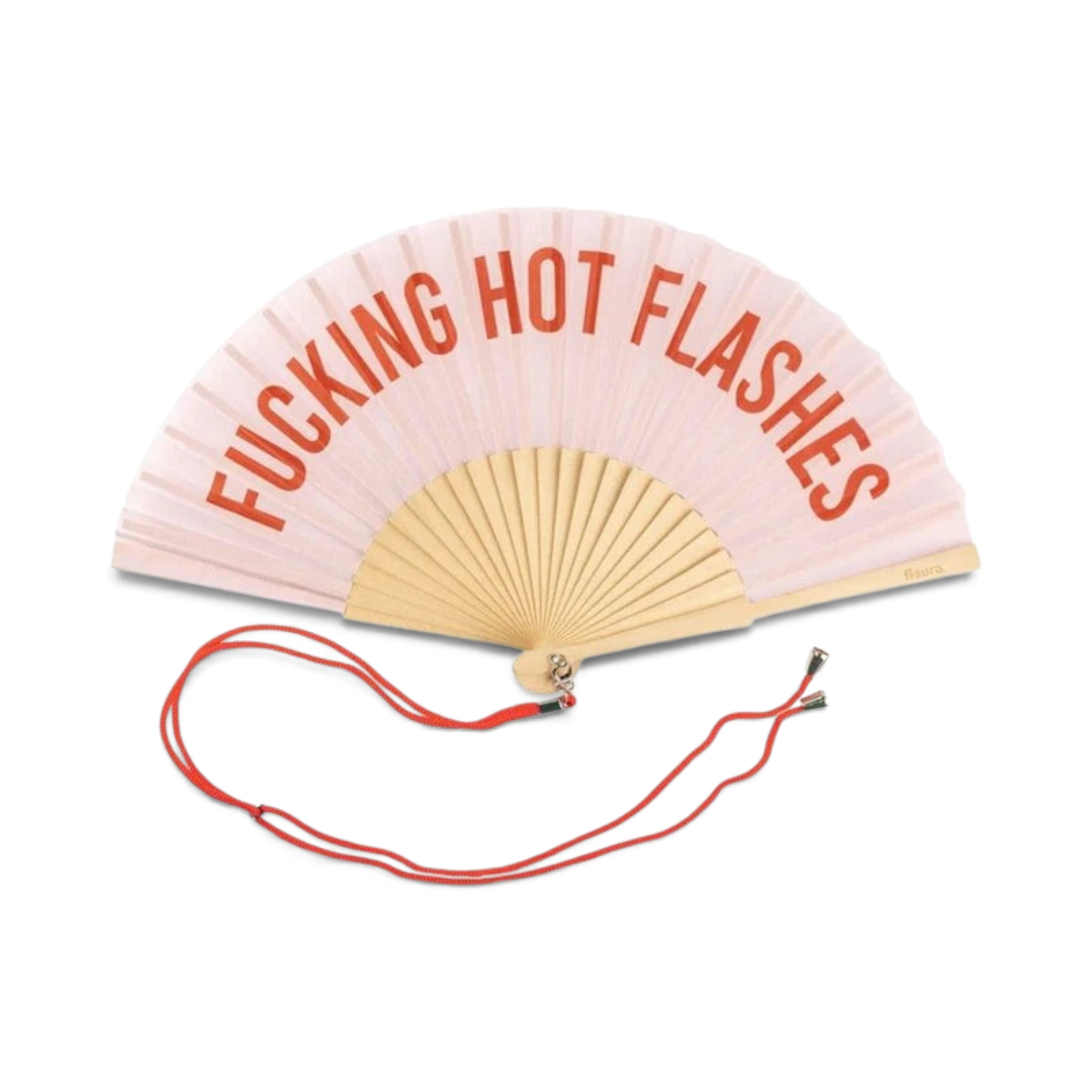 The Happy Shoe Shop Fisura bamboo hand fan in light pink with red text reading FUCKING HOT FLASHES and a red cord