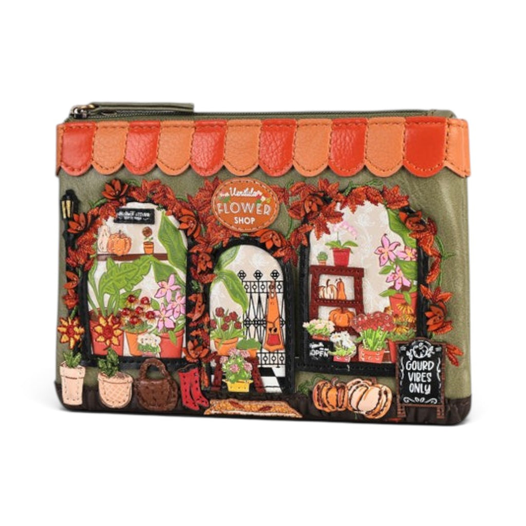 The Happy Shoe Shop Vendula London Flower Shop zipper coin purse in amber vegan leather with floral and pumpkin motifs.
