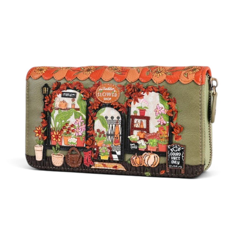 The Happy Shoe Shop Vendula London Flower Shop ziparound wallet in green vegan leather with amber floral autumn motifs.