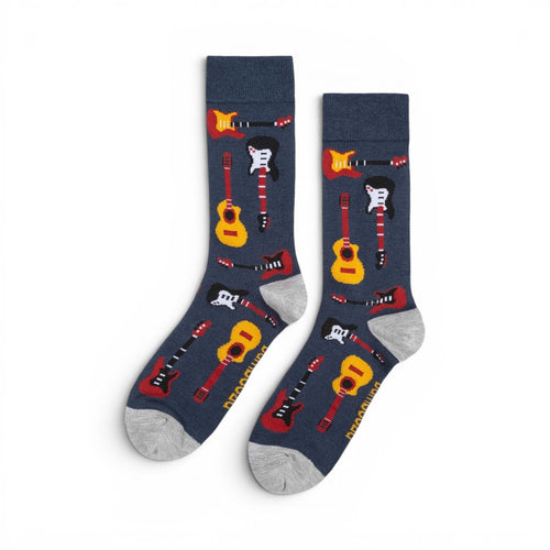 The Happy Shoe Shop Men's navy blue bamboo socks with a pattern of red, yellow, and black guitars. Grey heel and toe.