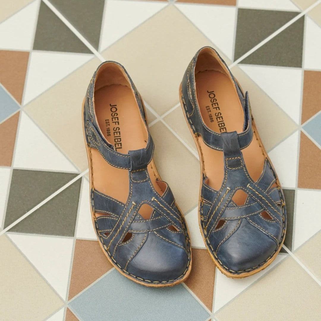 The Happy Shoe Shop Josef Seibel Rosalie 29 blue leather closed-toe sandals with T-strap and contrast stitching.