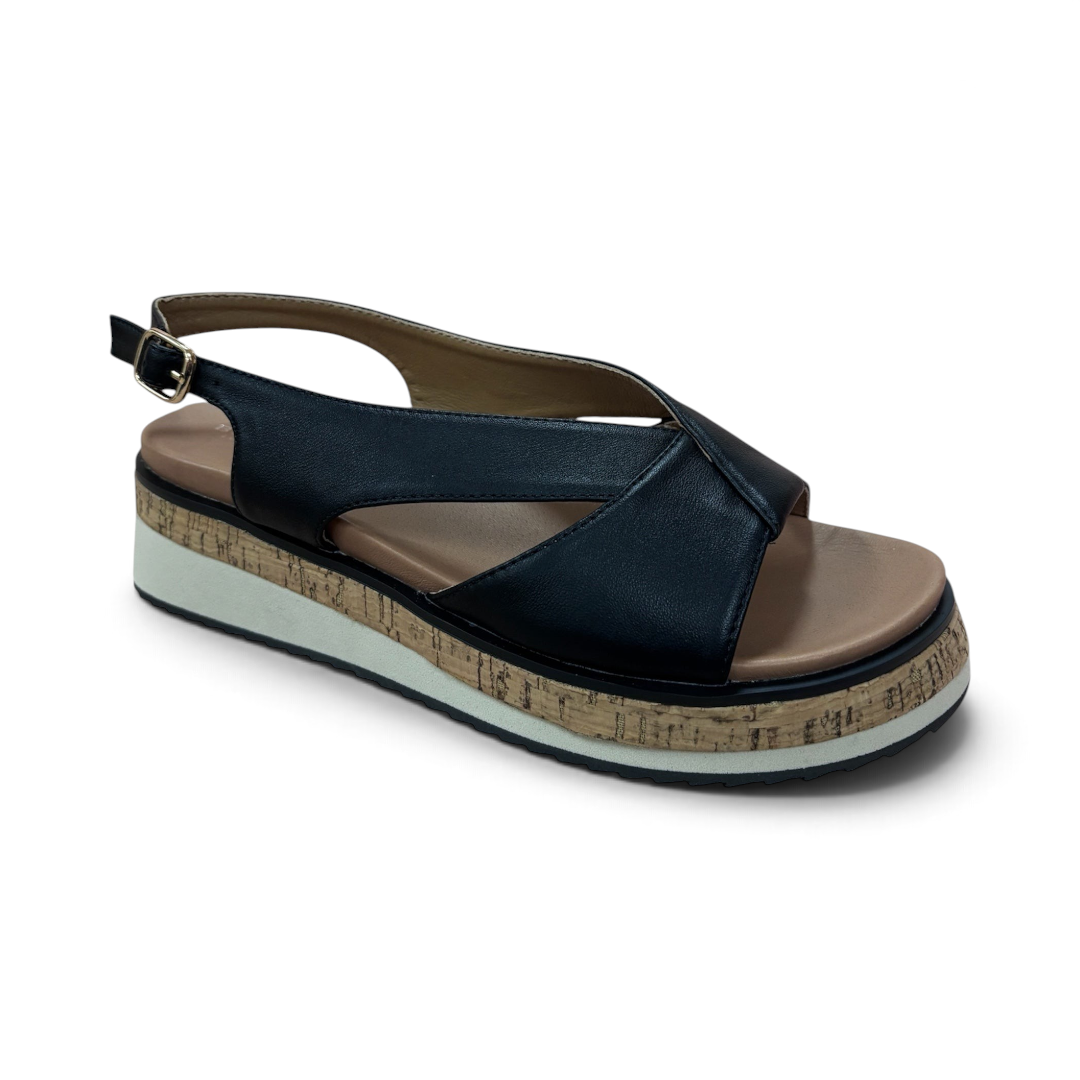 The Happy Shoe Shop Bay Lane Lacey black platform sandals with a criss-cross strap, slingback, and cork-look sole.