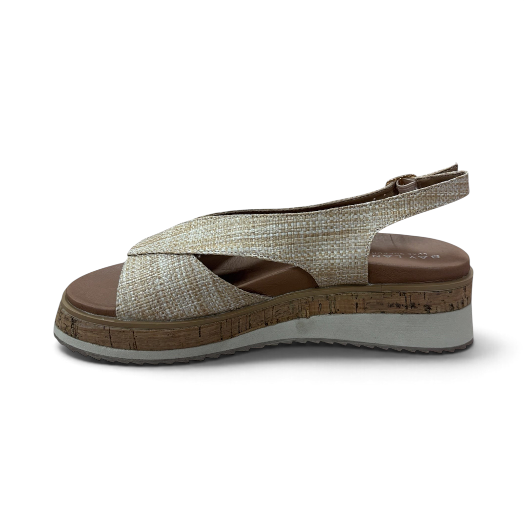 The Happy Shoe Shop Bay Lane Lacey platform sandals in beige woven fabric with a slingback strap and cork-look sole.