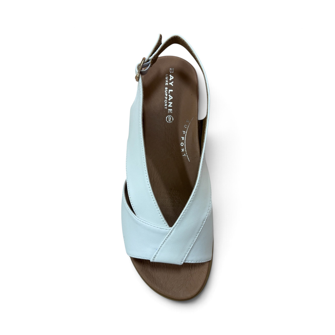The Happy Shoe Shop Bay Lane Lacey white platform sandals with a criss-cross strap design and cushioned footbed.