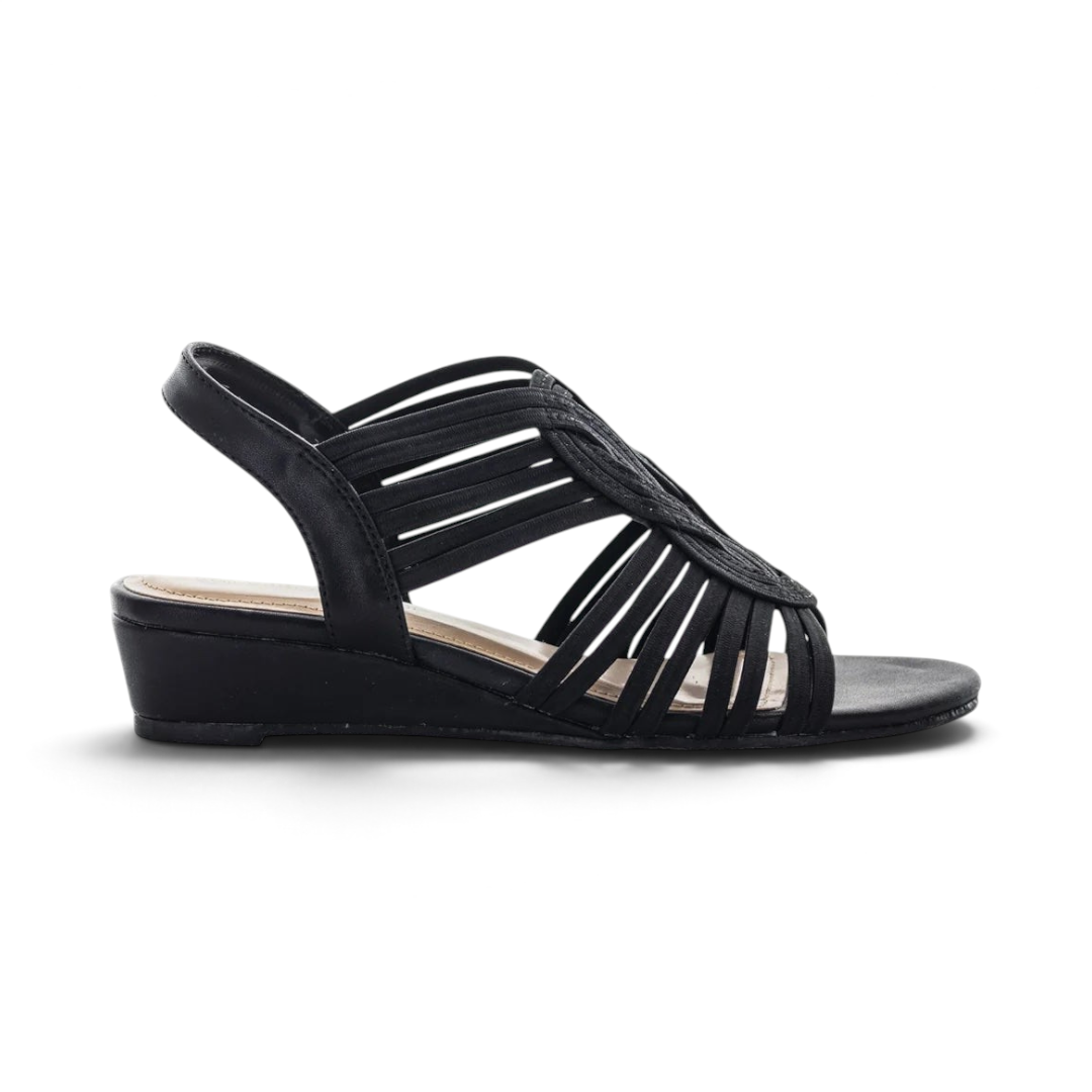 The Happy Shoe Shop Aerocushion Mora black dress wedge sandal with interlaced elastic straps and open-toe design.
