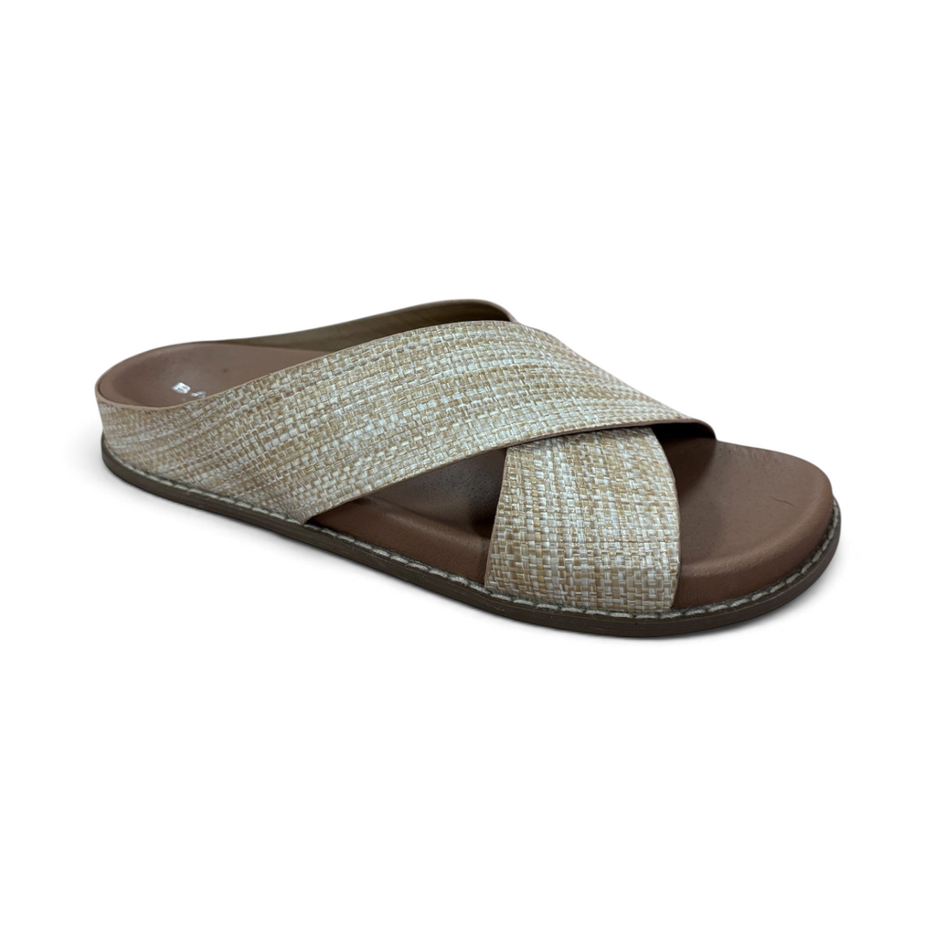 The Happy Shoe Shop Bay Lane Mystic slides featuring a beige woven criss-cross strap and a comfortable brown footbed.