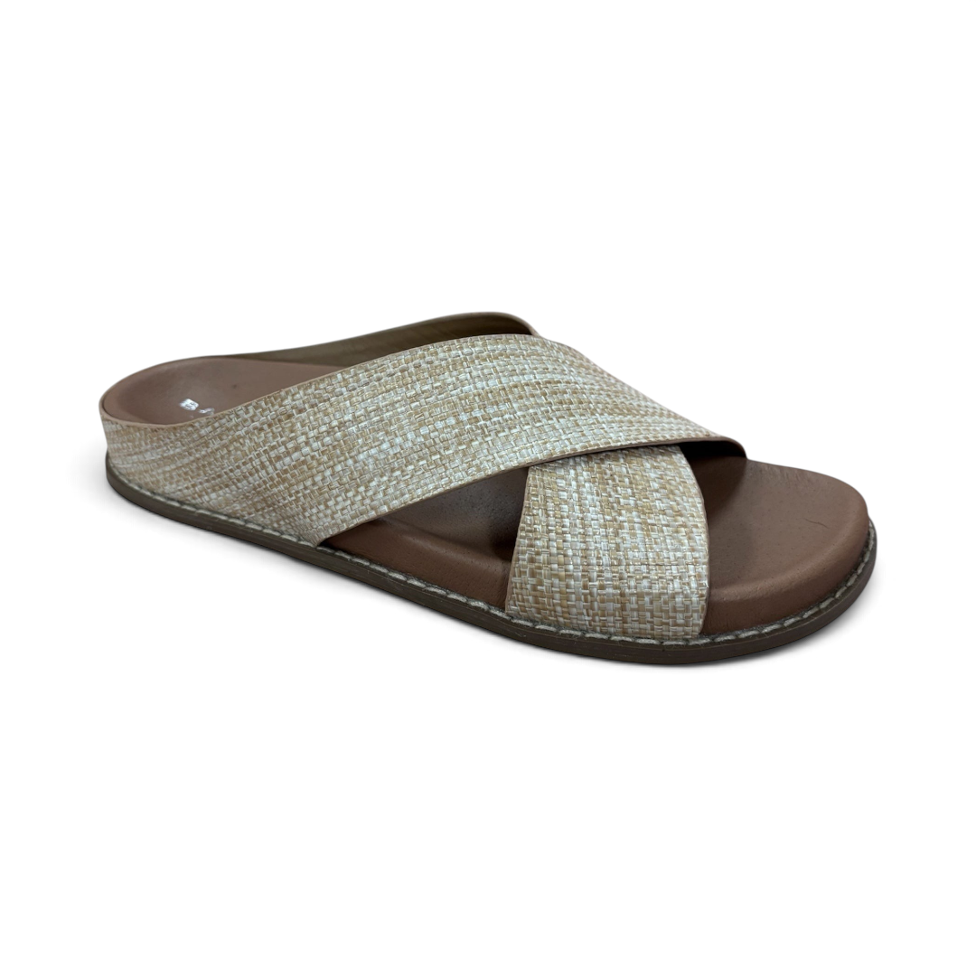 The Happy Shoe Shop Bay Lane Mystic slides featuring a beige woven criss-cross strap and a comfortable brown footbed.