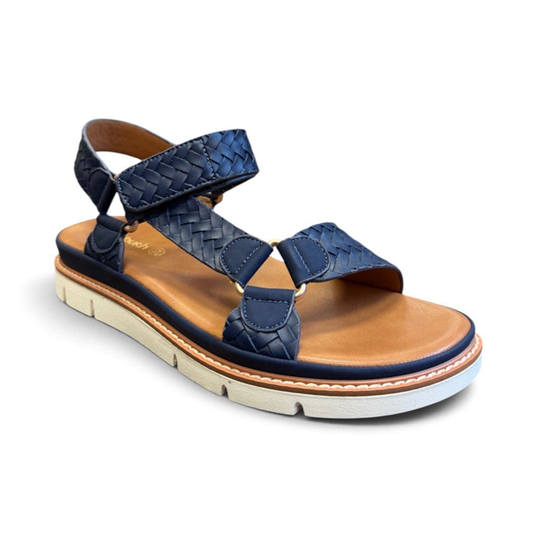 The Happy Shoe Shop Soultbush Harbour navy woven leather-look sandal with tan footbed and white platform sole.