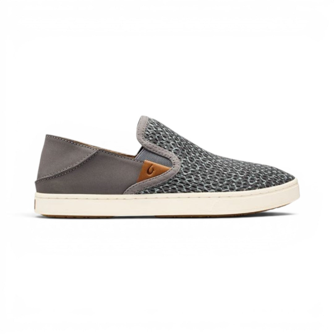 The Happy Shoe Shop Olukai Pehuea Pa'i charcoal canvas slip-on sneaker with drop-in heel and embossed leather logo.