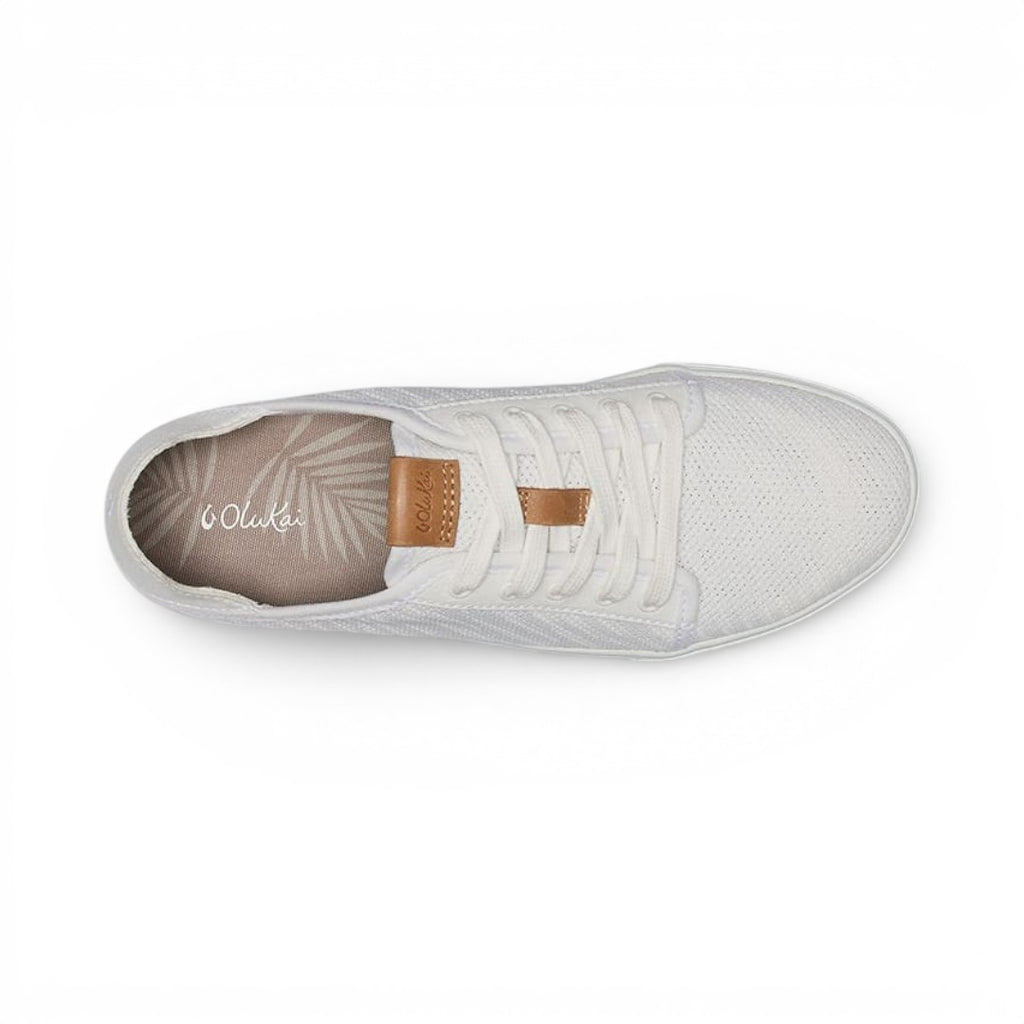 The Happy Shoe Shop Olukai Pehuea Li white mesh lace-up sneaker with tan leather accents and drop-in heel design.