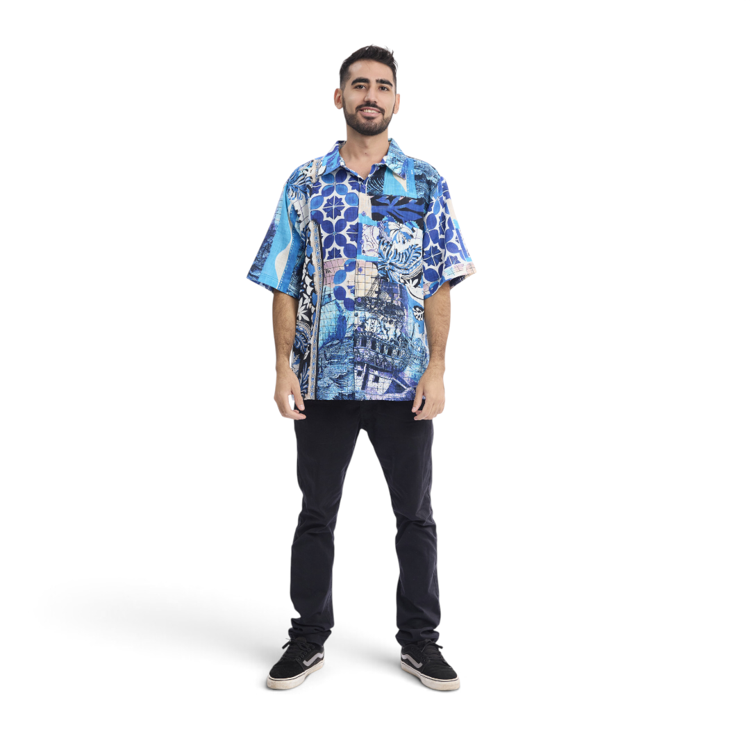 The Happy Shoe Shop model wearing an Orientique blue patchwork organic cotton short sleeve shirt with a chest pocket