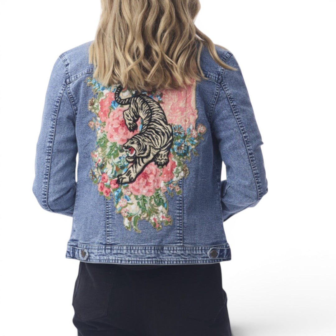 The Happy Shoe Shop Orientique Keqioa denim jacket with back tiger and floral embroidery on a blonde model.
