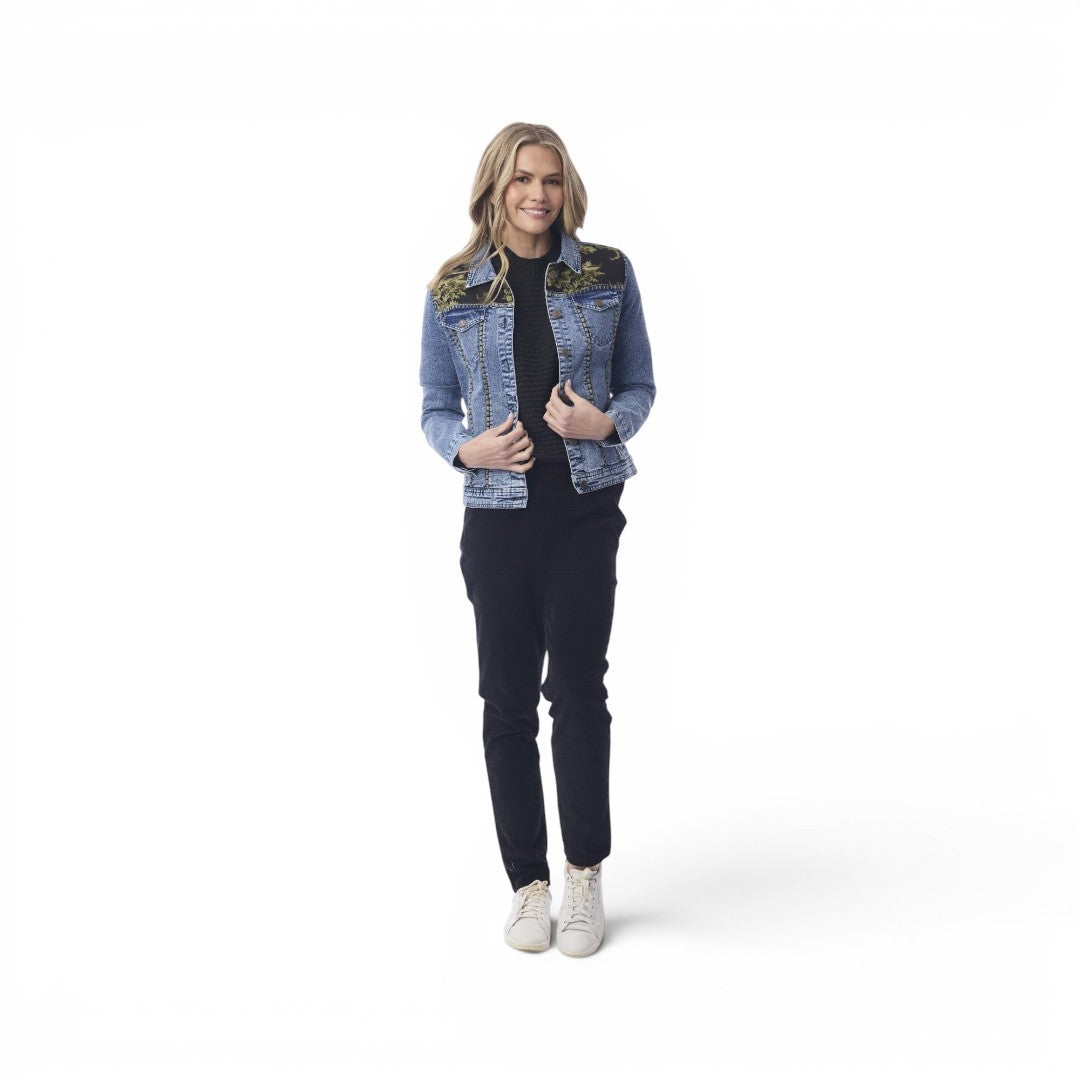 Model wearing The Happy Shoe Shop Orientique Keqioa denim jacket with floral embroidery and button-through front.