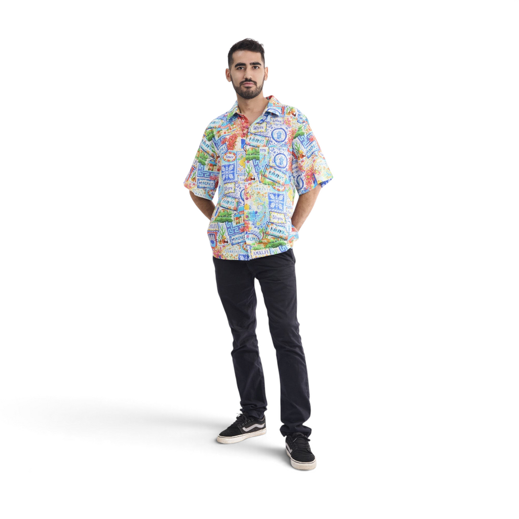 Model wearing a The Happy Shoe Shop Orientique short sleeve shirt with a colourful patchwork print in organic cotton.