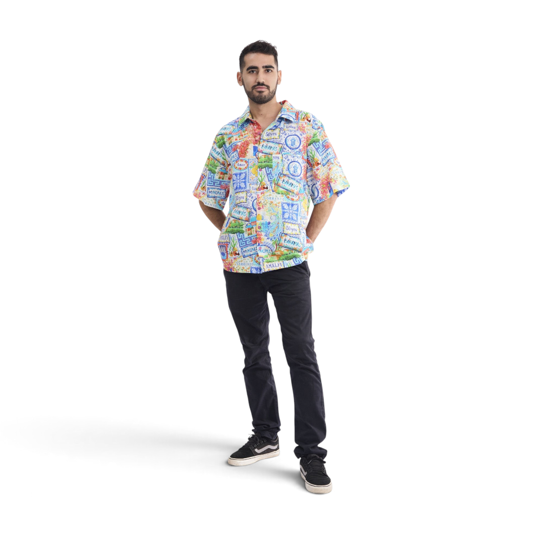 Model wearing a The Happy Shoe Shop Orientique short sleeve shirt with a colourful patchwork print in organic cotton.