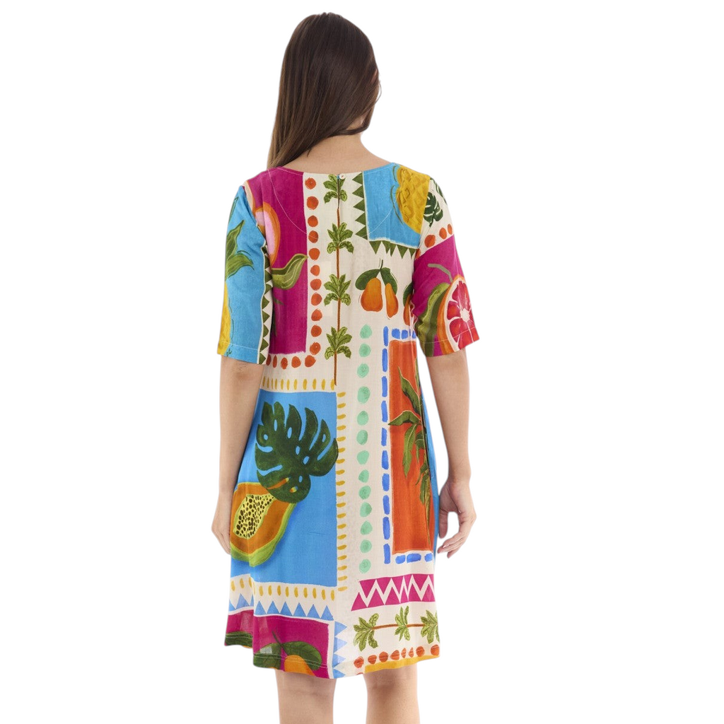 The Happy Shoe Shop Orientique Escape dress in a vibrant tropical print with elbow sleeves and a knee-length cut.