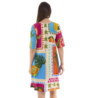 The Happy Shoe Shop Orientique Escape dress in a vibrant tropical print with elbow sleeves and a knee-length cut.