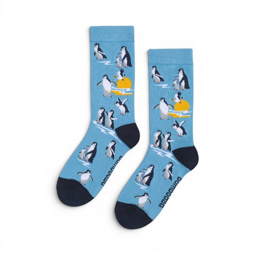 The Happy Shoe Shop unisex blue bamboo socks with a penguin and sunset pattern. Made from 80% bamboo.