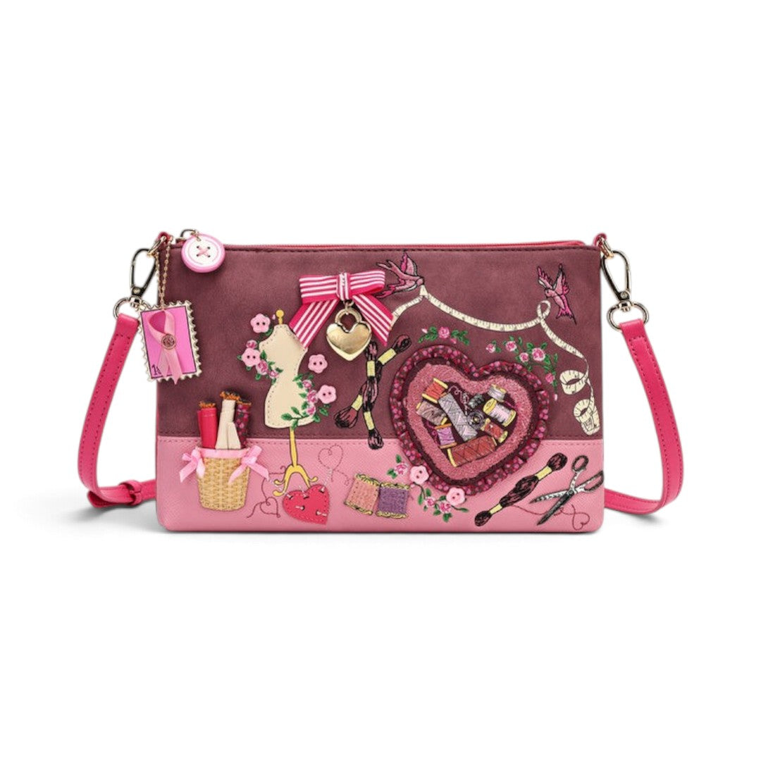 The Happy Shoe Shop Vendula London sewing box scrapbook bag in pink vegan leather with detailed sewing embroidery.