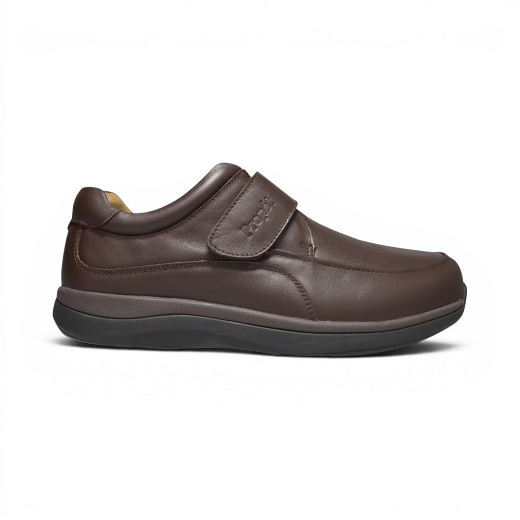The Happy Shoe Shop Propet men's brown leather shoe with adjustable velcro strap and padded collar.
