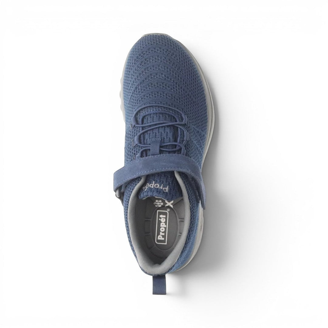 The Happy Shoe Shop Propet Mens Tour Knit FX blue mesh sneakers with elastic laces and Velcro strap.